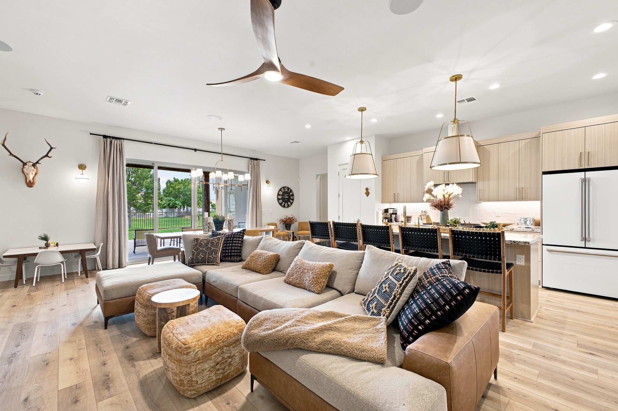 Professional interior photo of a bright open-plan living room and kitchen